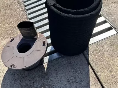 Boiler coil removed from Nilfisk DTE 500HM hot pressure washer during contaminated fuel repair in Leicester.